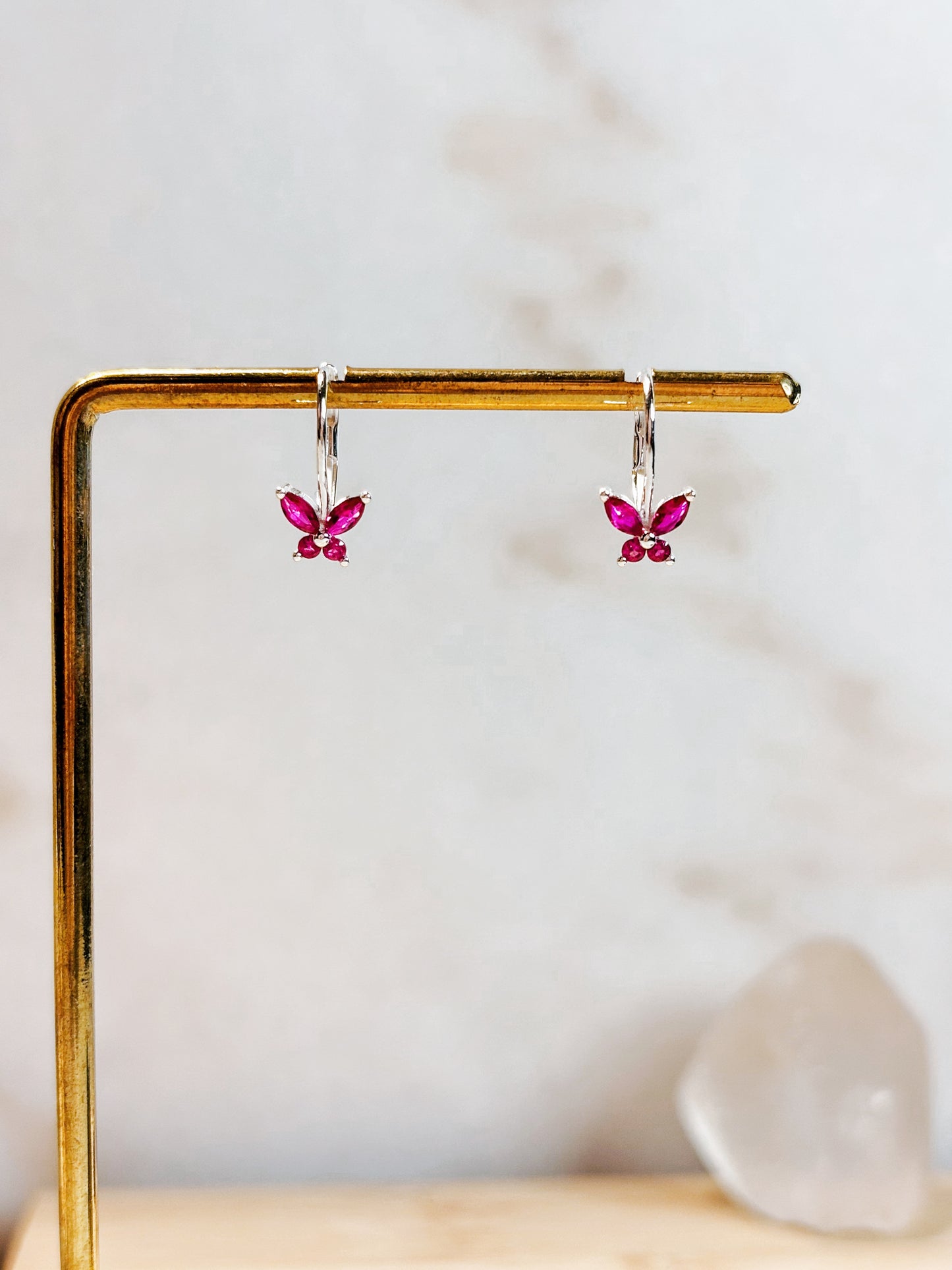 Aros mariposa circón fucsia