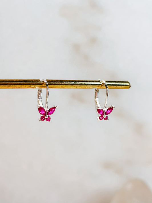 Aros mariposa circón fucsia