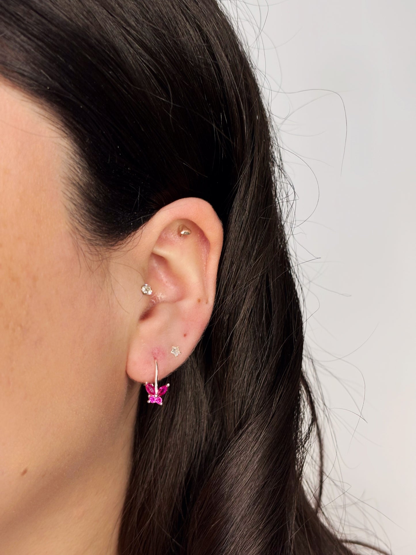 Aros mariposa circón fucsia