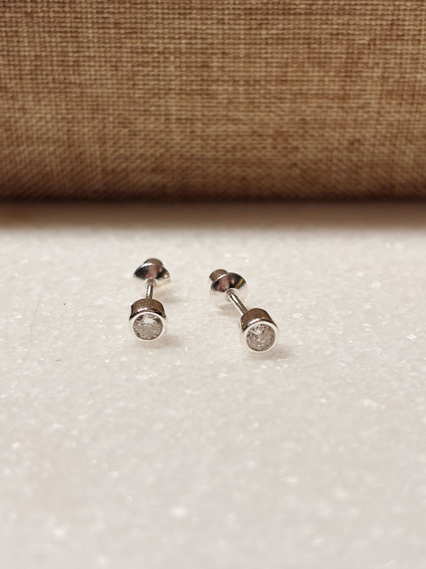 Piercing punto circón